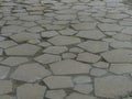 Stone floor with gray heptagonal shapes of different sizes