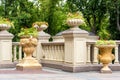 Stone flowerpots at the railing with balustrades.