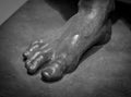 Stone foot of ancient Roman statue Royalty Free Stock Photo