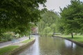 Stone footbridge across the River Windrush in Bourton-on-the-Water, also known as The Venice of the Cotswolds - Gloucestershire - Royalty Free Stock Photo