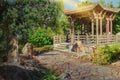 Stone footpath leading to asian wooden gazebo