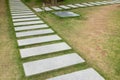 Stone footpath steps on grass. Walking path Royalty Free Stock Photo