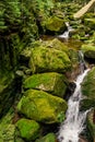 Stone formation in the mountains - waterfall in the dark forest. Royalty Free Stock Photo