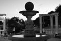 Stone fountain with bowl and sphere on top at dusk. Gagarin Boulevard, Pyatigorsk, Russia