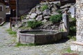 Stone fountain in mountain village