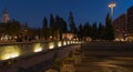 A stone fountain at night