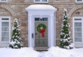 Stone fronted house with wreath on front door