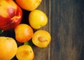 Stone fruits on wooden background. Yellow plums, apricots and nectarines Royalty Free Stock Photo