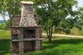 Stone garden oven for grill or barbeque is in a backyard Royalty Free Stock Photo