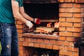 Stone garden oven for grill or barbeque is in a backyard Royalty Free Stock Photo