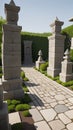 A stone garden with a stone path of ancient spiritual sculptures. Totem sculptures. An inner courtyard with a stone path. Royalty Free Stock Photo