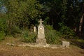 Stone gravetombs and woorden crosses on a cemetery s in the Romanian countryside