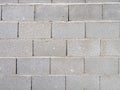 Stone gray masonry. Wall. Strong fence. Background from cement blocks