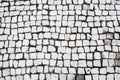 Stone walled cobbled street. paving tiles and bricks patterns from natural stone. Royalty Free Stock Photo