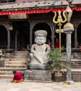 Stone guardian and Hindu symbols