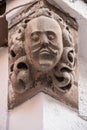 Stone head on the corner of an old building Royalty Free Stock Photo