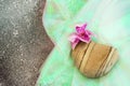 Stone heart with orchid flower Royalty Free Stock Photo