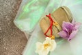 Stone heart with orchid flowers and bracelets Royalty Free Stock Photo