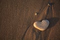 Stone heart on the pebble beach. Love concept. Valentine background Royalty Free Stock Photo