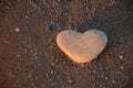 Stone heart on the pebble beach. Love concept. Valentine background Royalty Free Stock Photo