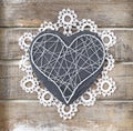 Stone heart on wooden background