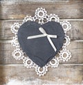 Stone heart on wooden background