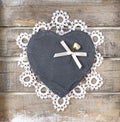 Stone heart on wooden background