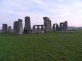 Stone Henge In England Winter Time Tourist in distance