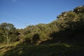 Stone hill with forest and blue sky in Antonio Rosa Park in Brazil