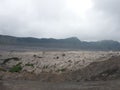 the rocky dunes and sea of sand at the foot of Mount Bromo