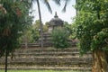 Stone hindu temple under trees in Kandy Royalty Free Stock Photo