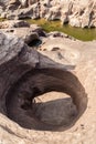 The stone hole caused by the water erode in Mekhong river after