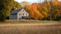 Stone House in Autumnal Forest with Grassy Field Royalty Free Stock Photo