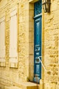 Stone house with blue door and shutters window Royalty Free Stock Photo