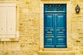 Stone house with blue door and shutters window Royalty Free Stock Photo