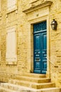 Stone house with blue door and shutters window Royalty Free Stock Photo