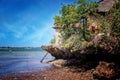 Stone house on a cliff above the sea on Wasini island, Kenya. It is in Africa. The Indian Ocean is beautifully blue and