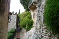 Stone house covered with ivy and flowers of St Paul in Nice, France, with quite a lot of stairs