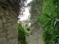 Stone house covered with ivy and flowers of St Paul in Nice, France, with quite a lot of stairs