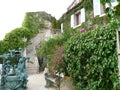 Stone house covered with ivy and flowers of St Paul in Nice, France, with quite a lot of stairs