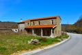 Stone house next to a road Royalty Free Stock Photo