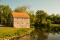 Stone house next to a winding river