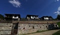 Stone house with stone fence in the Village of Leshten. Historical, facade. Royalty Free Stock Photo