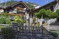 stone houses with geraniums on balconies in Sonogno