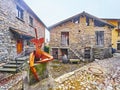 The stone houses and modern sculpture by Marco Prati, on March 16 in Bre, Switzerland