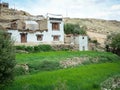 Stone houses with rice fields at the Nubra valley in Ladakh, India Royalty Free Stock Photo