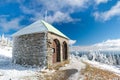 Stone hut / shelter Jeleni studanka in Jeseniky mountains in Czechia during nice winter day with clear sky. Wiew of Czech cottage Royalty Free Stock Photo