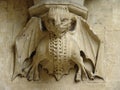 Stone imp carving on wall