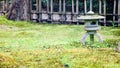 Stone Japanese lantern in a traditional oriental garden