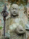 Stone Jizo statue in the mountains